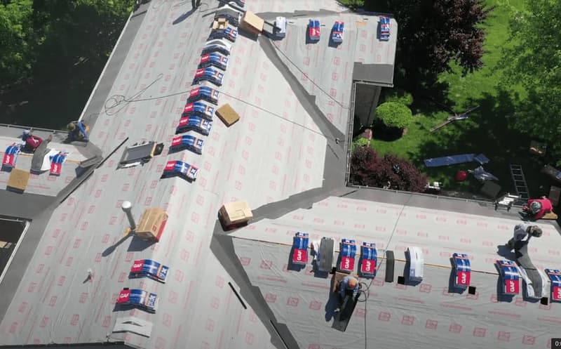 Aerial view of roof during underlayment installation